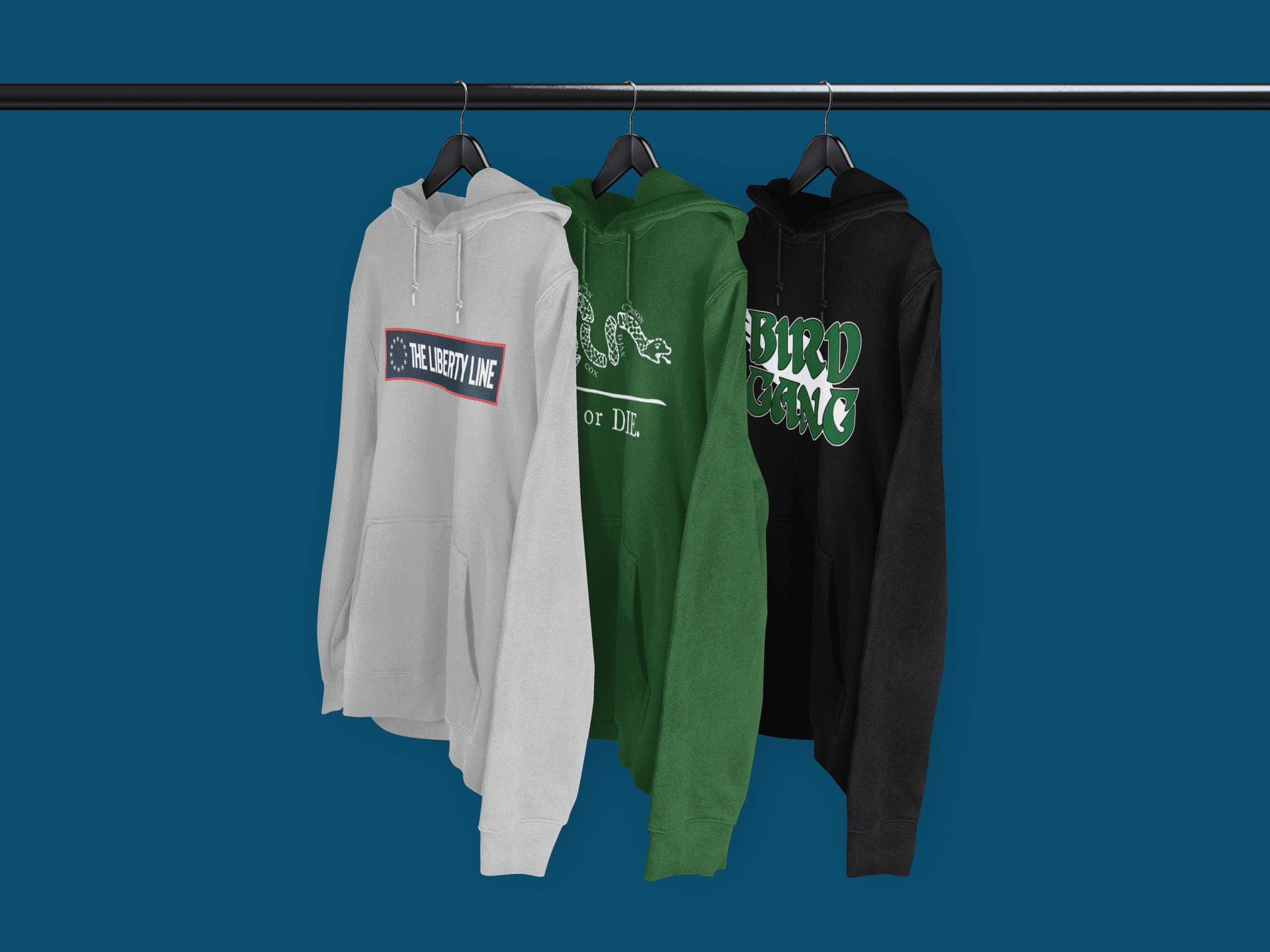 mockup-of-three-pullover-hoodies-hanging-from-a-rack-3587 ...